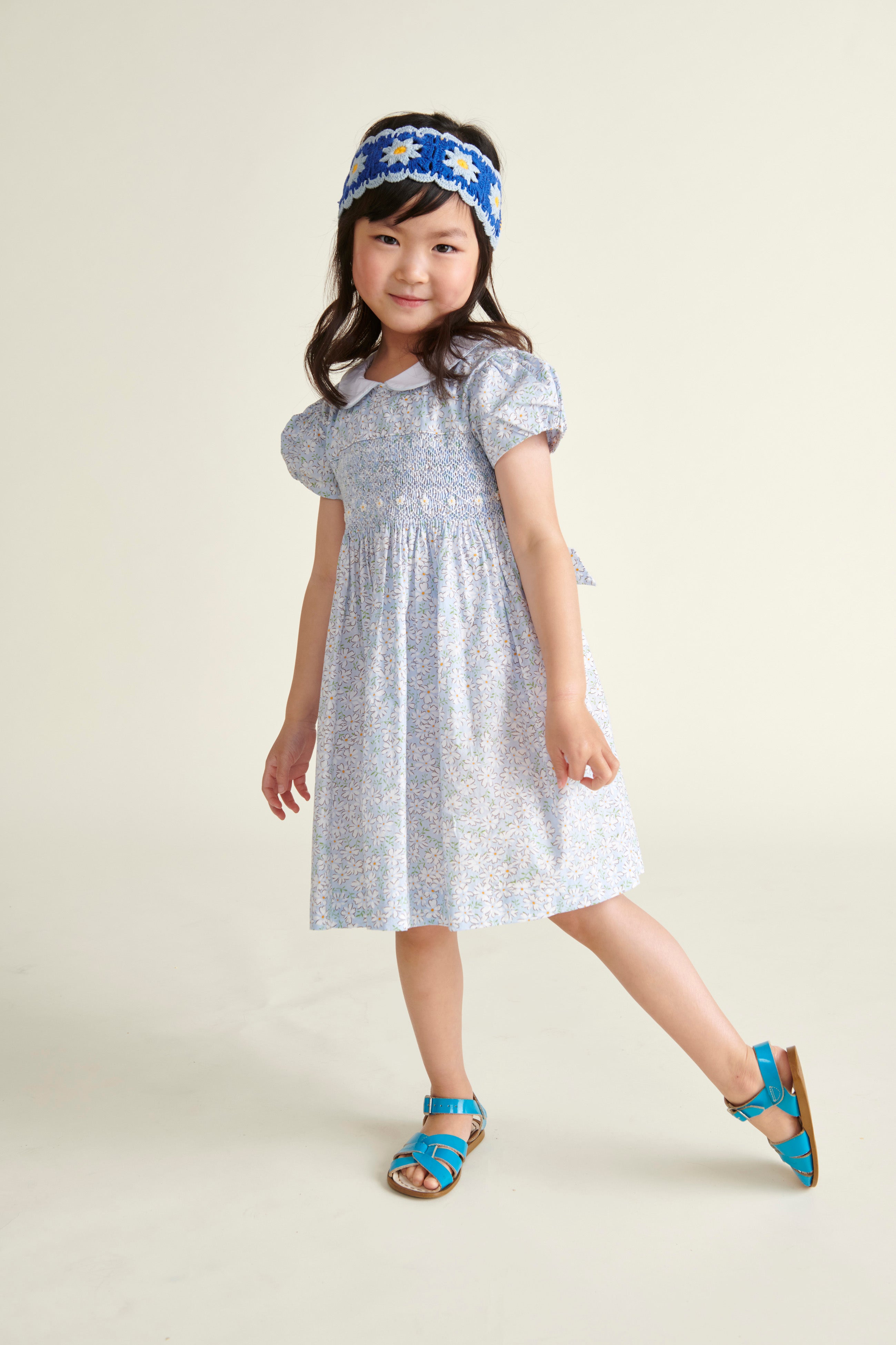 girl in smocked daisy dress