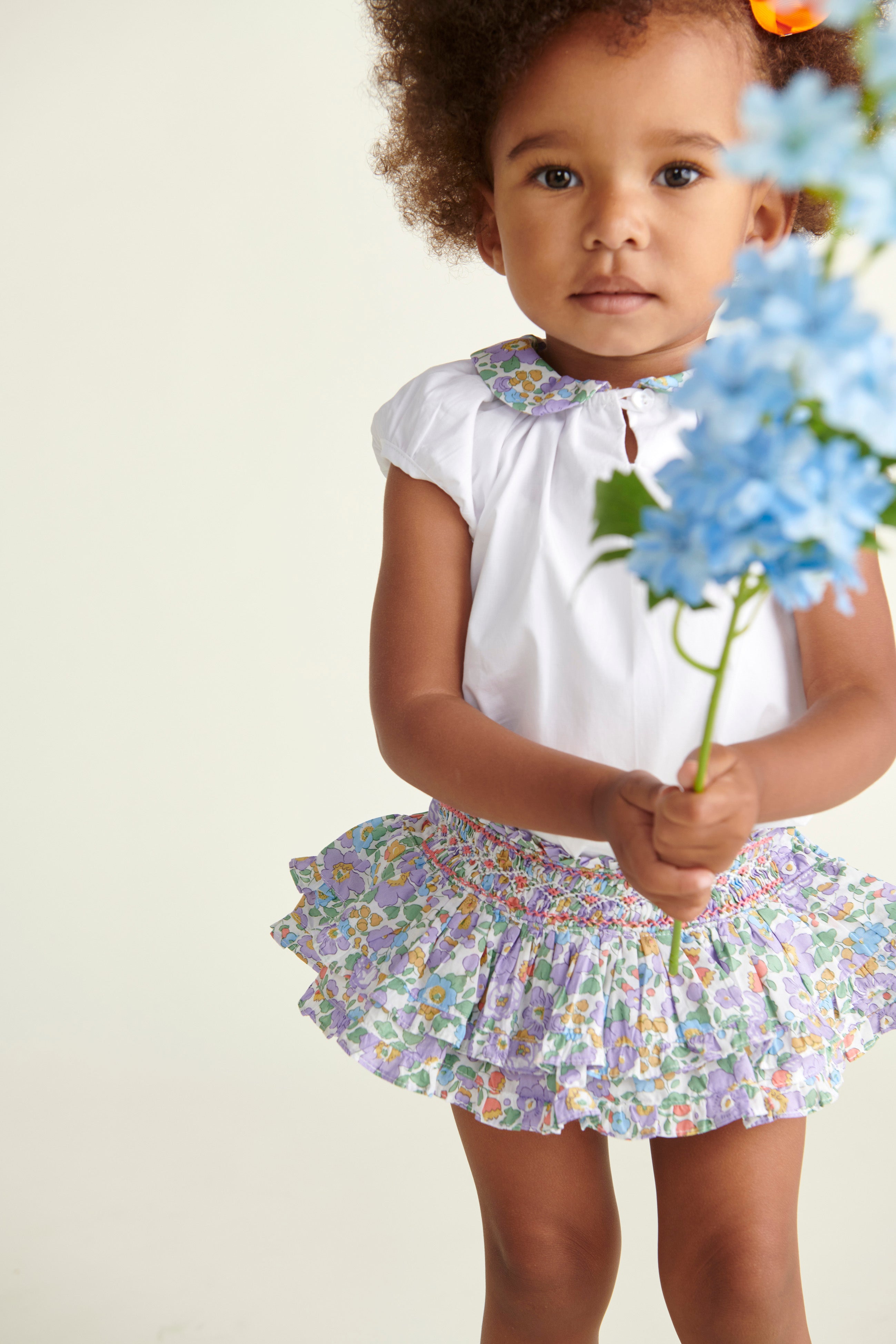 baby in matching skort and blouse outfit