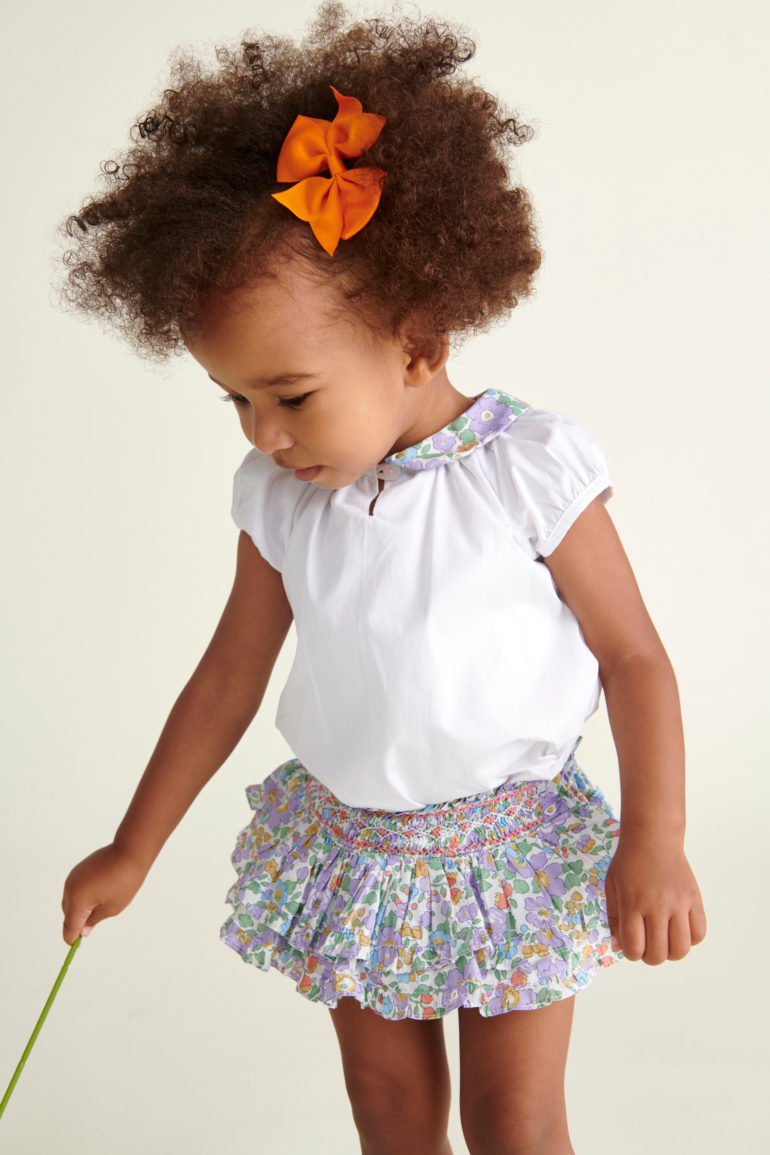 baby girl in skort and blouse 