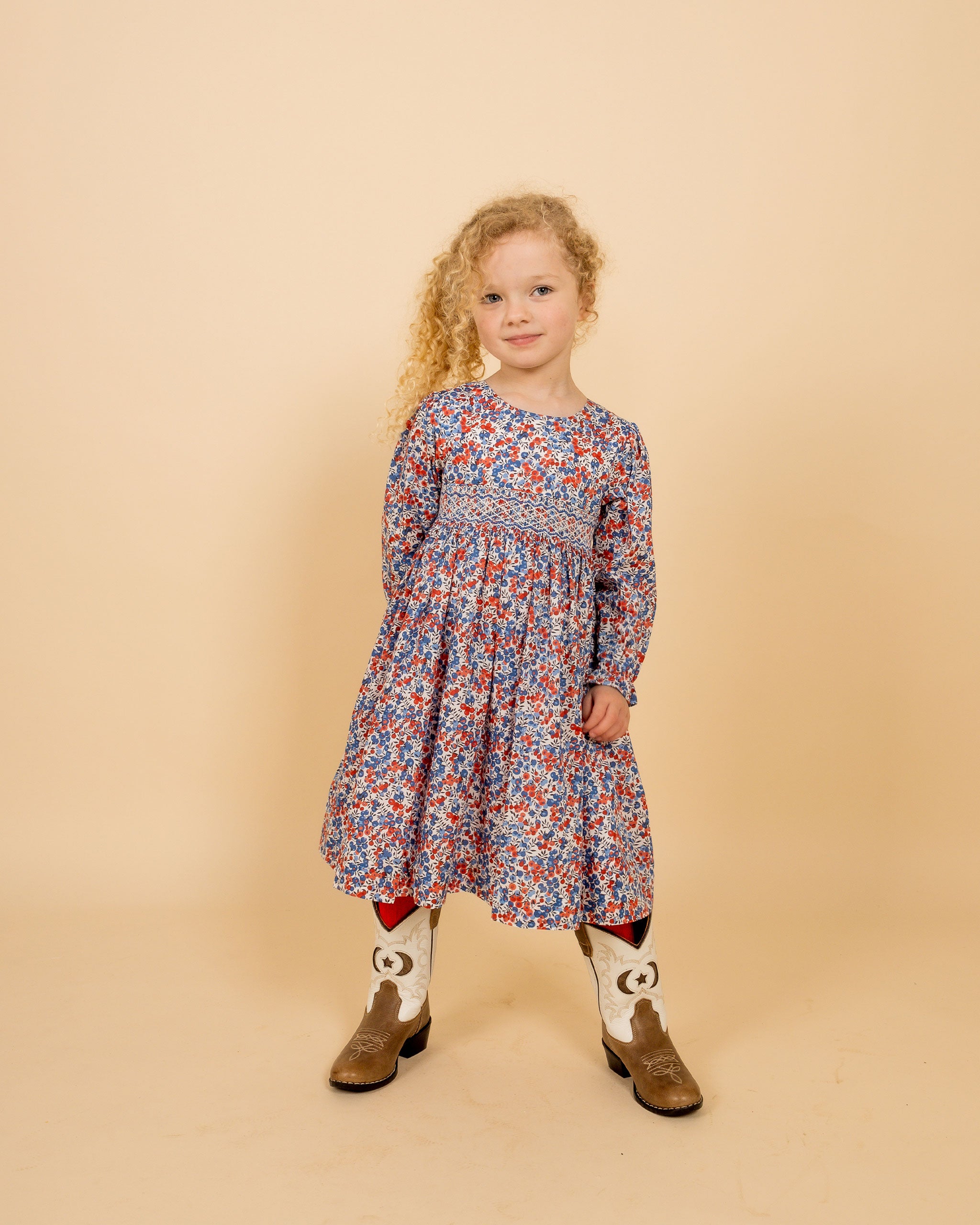 girl in hand-smocked dress made with Liberty Wiltshire fabric