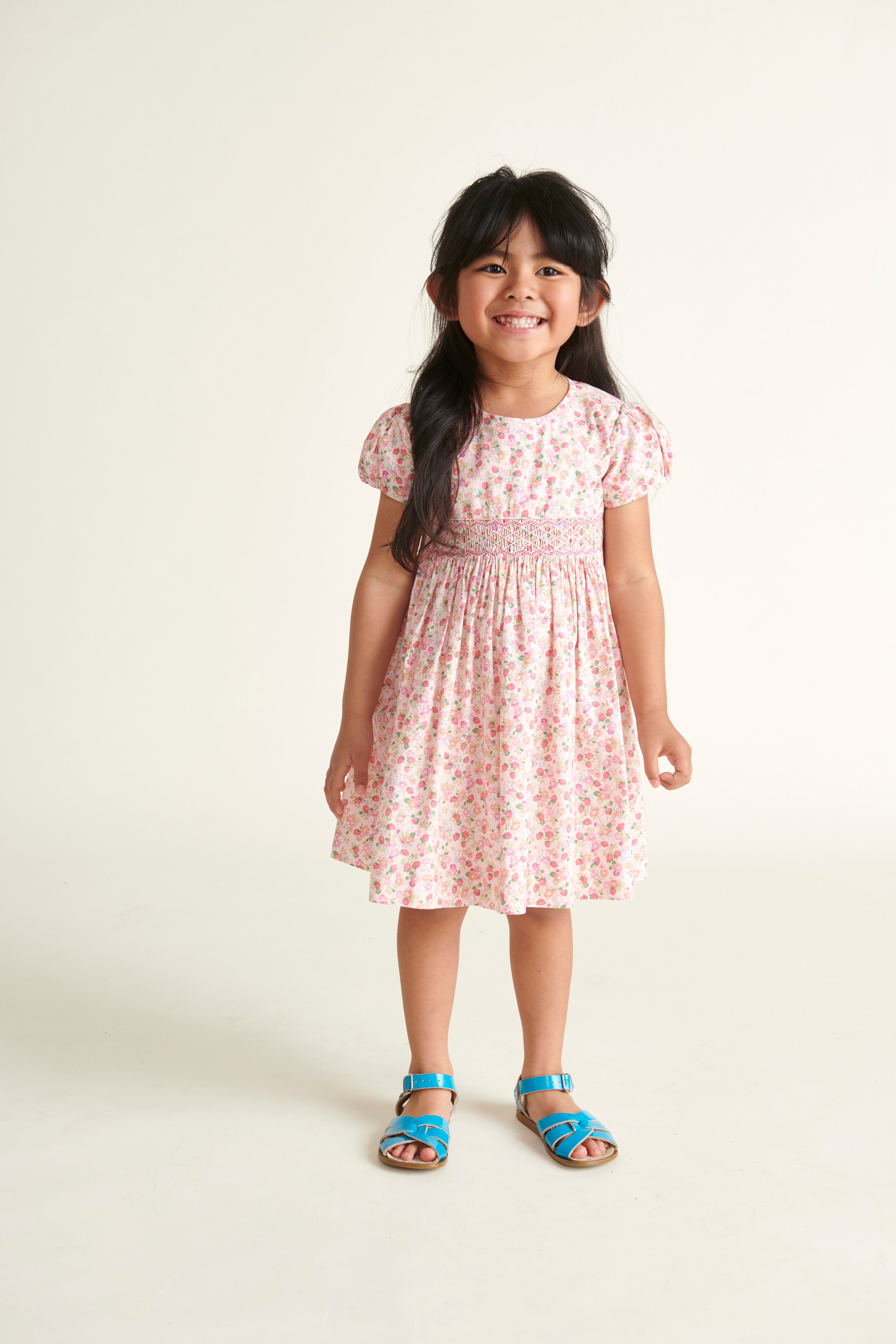 girl in strawberry smocked dress