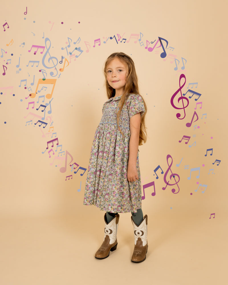 girl wearing dress made from Claire-Aude Organic Tana Lawn™ Cotton, hand-smocked