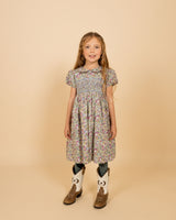 girl model in hand-smocked dress made with Liberty fabric