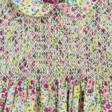 hand-smocked, floral baby dress, purple, pink and yellow blossoms, closeup of smocking