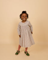 girl in smock dress with frill collar