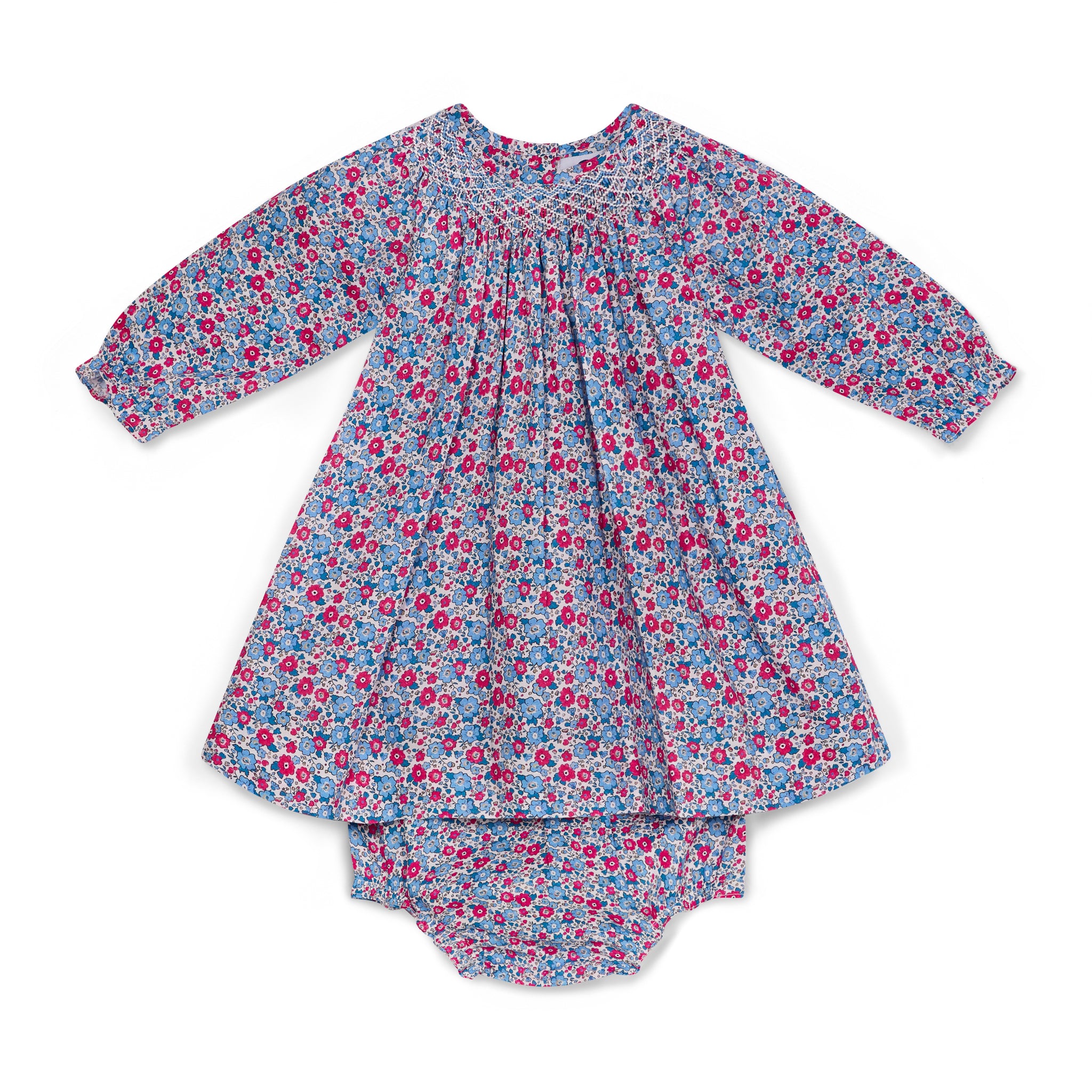 Floral hand-smocked dress with matching bloomers on a white background
