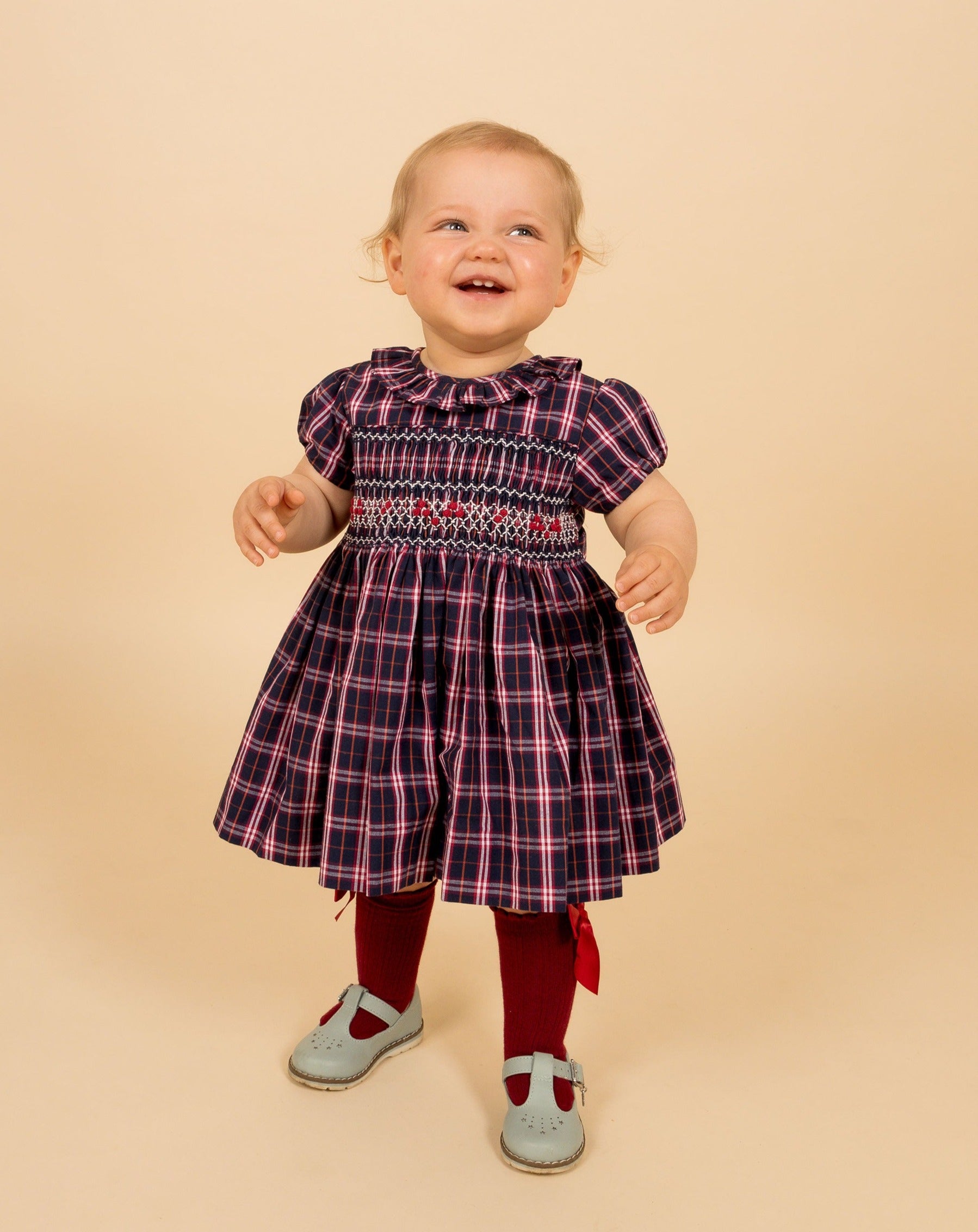 toddler wearing cool blue tartan smock dress