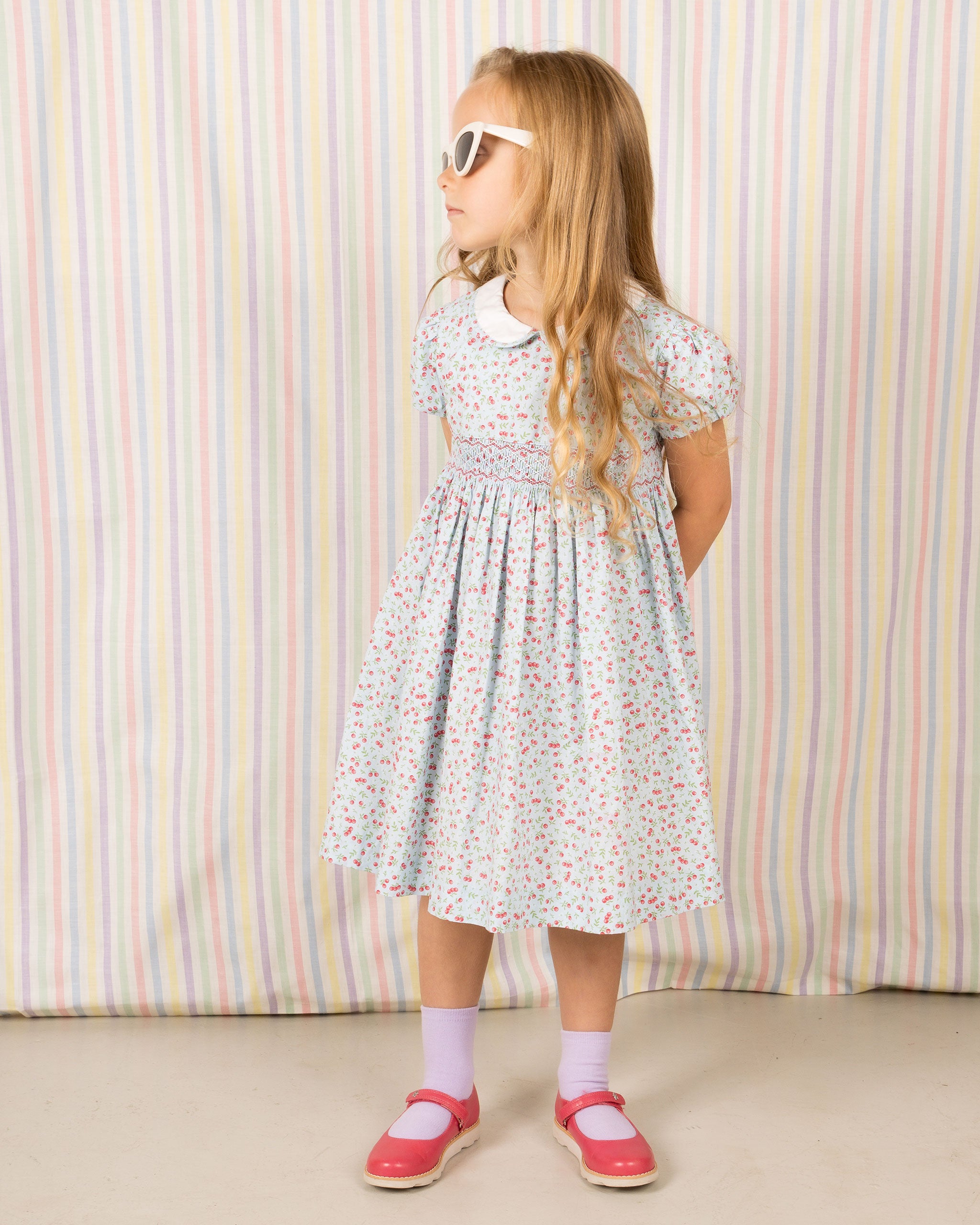 girl in cherry print summer dress