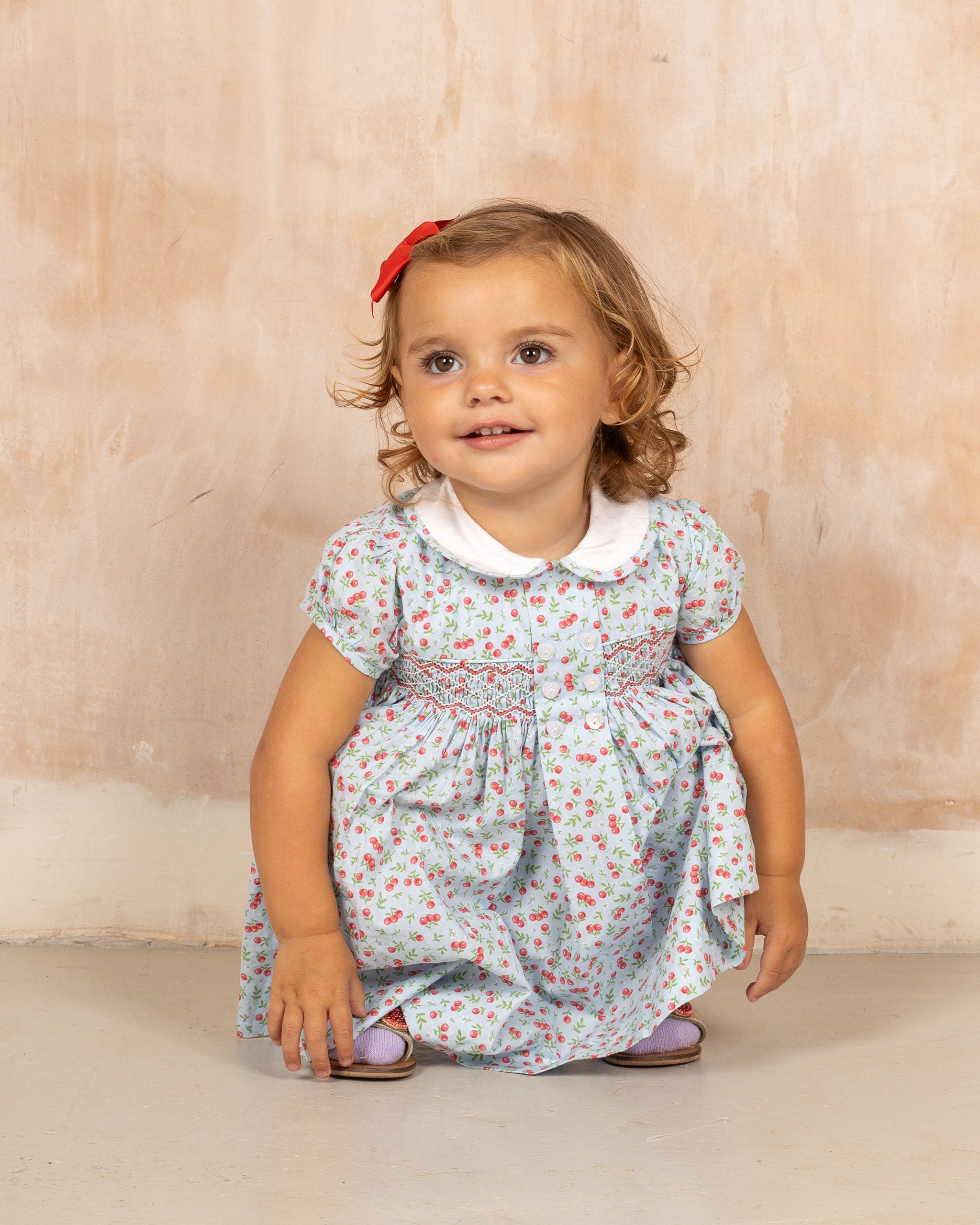 sweet baby in cherry smock dress