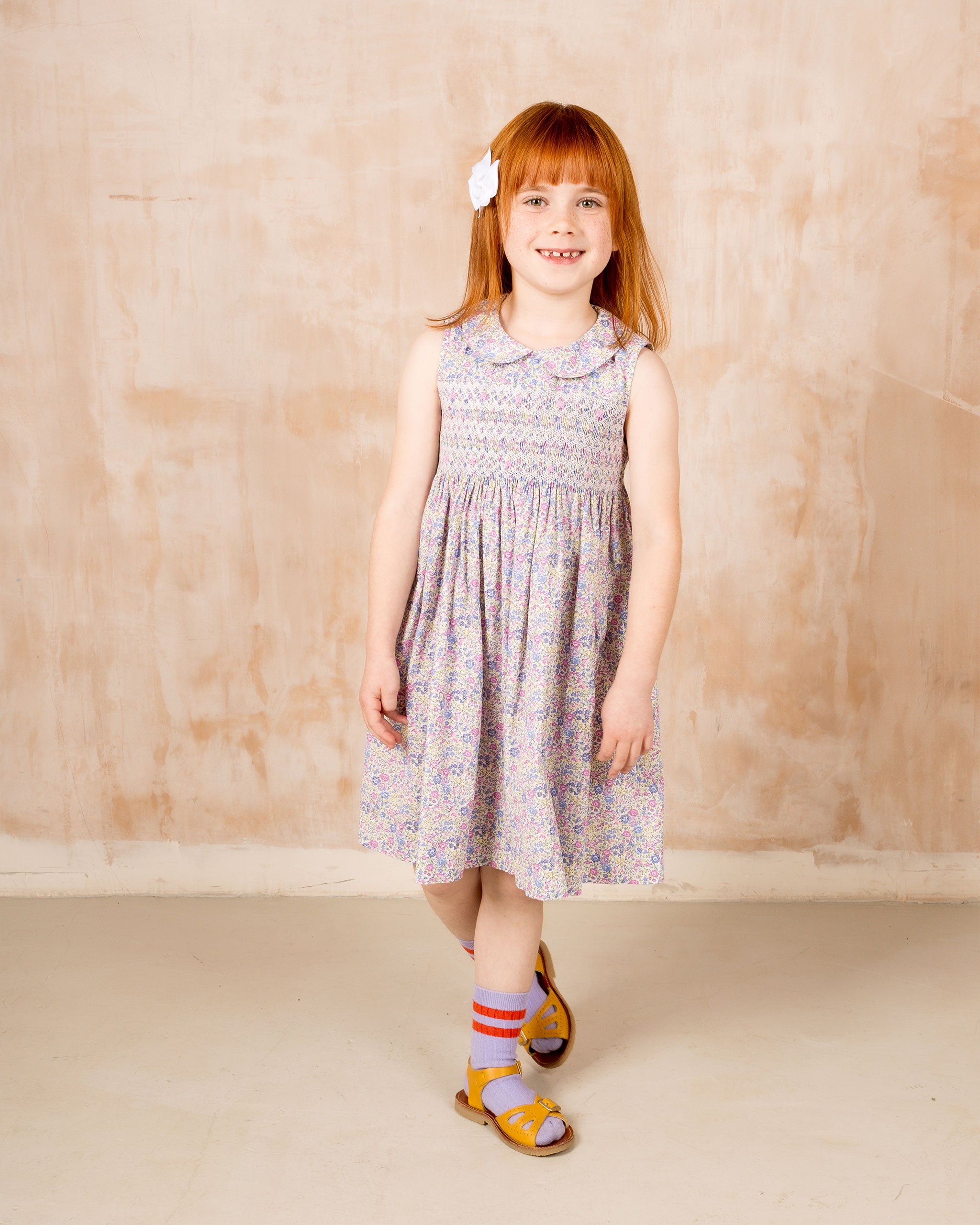 sleeveless hand-smocked summer dress worn by child model