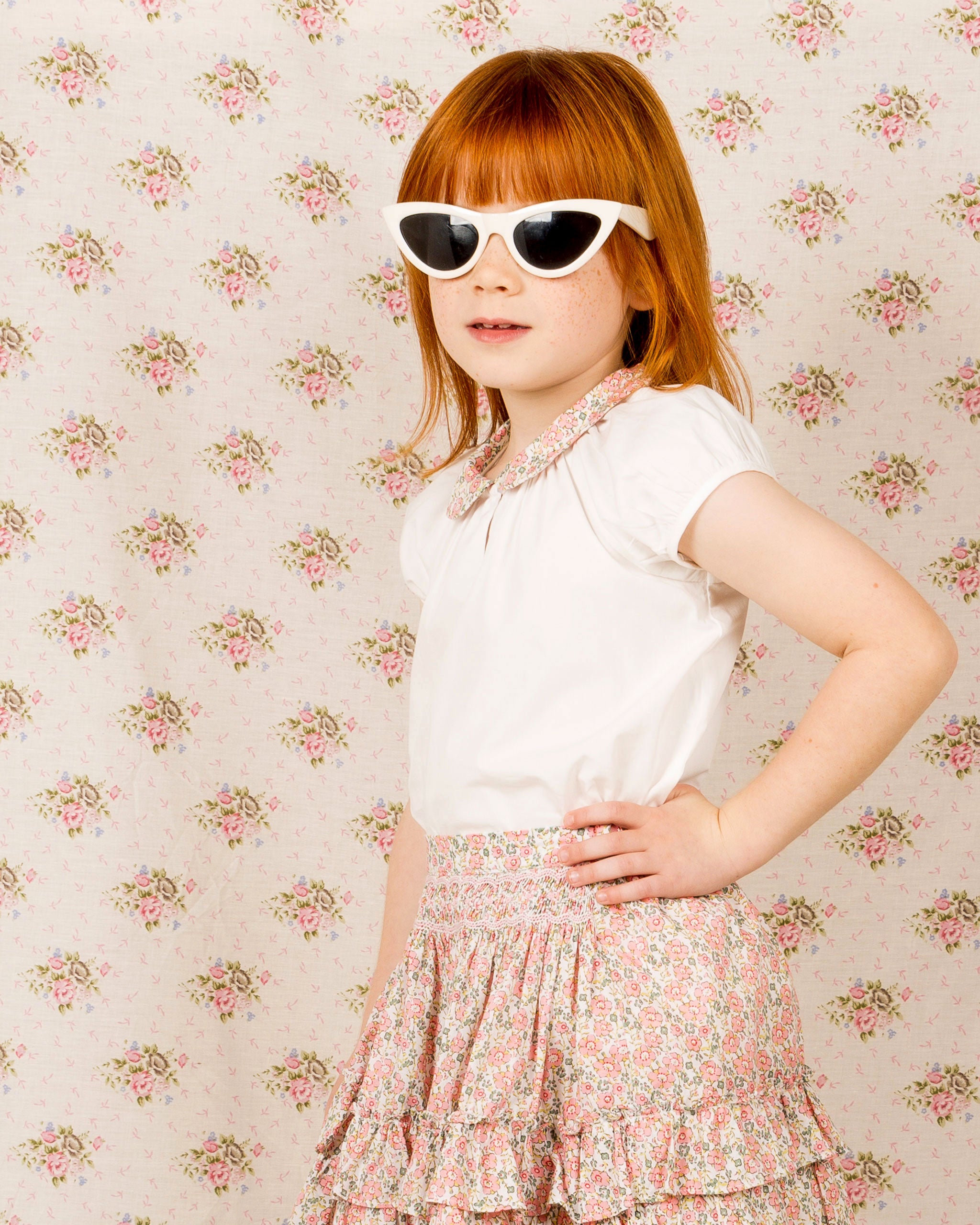 girls in white blouse with floral collar