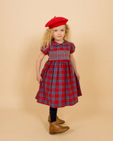 girl in red tartan dress