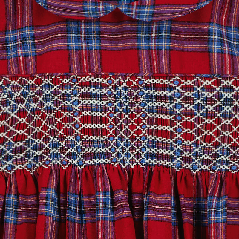 smocking detail on red tartan dress