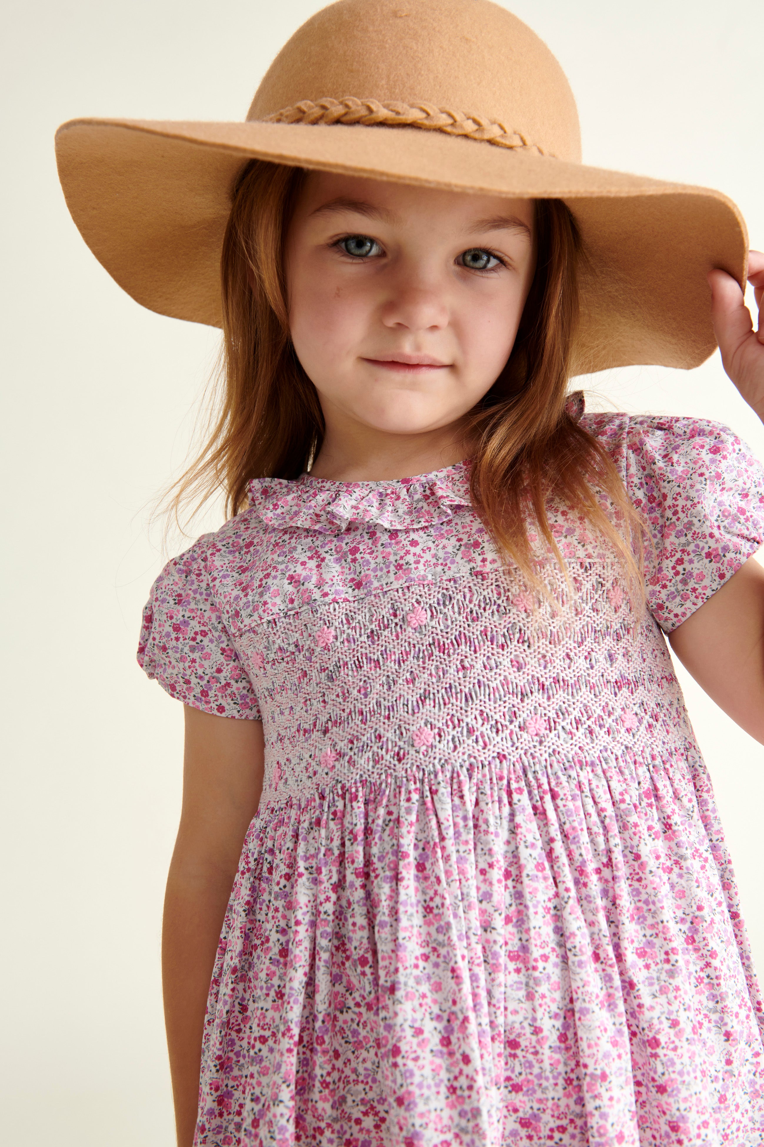 girl in frill collar smock dress, front