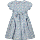 back of blue smocked dress, ties with bow