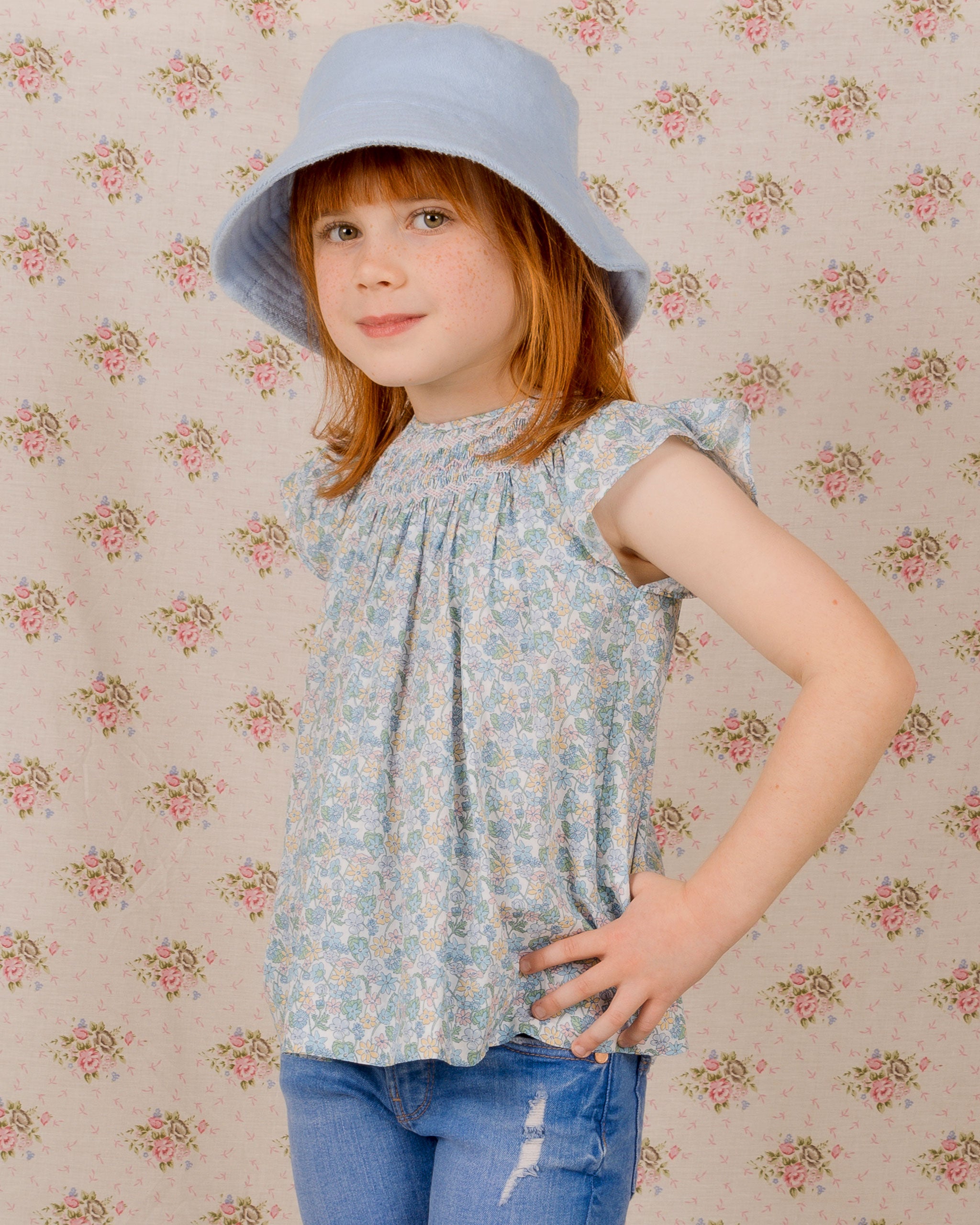 girl in sunhat and smocked blouse, Liberty fabric