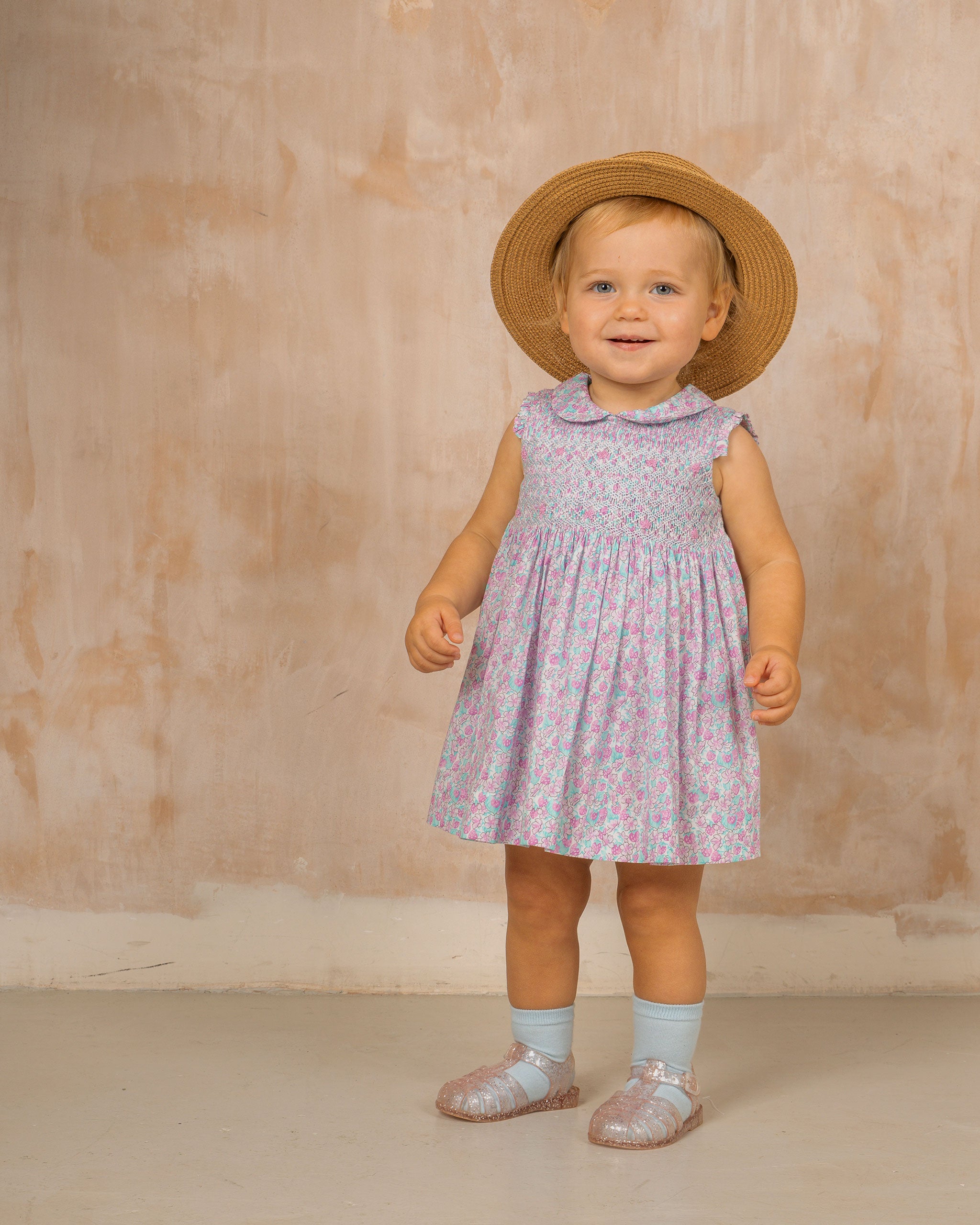 toddler girl in sun dress, strawberry print