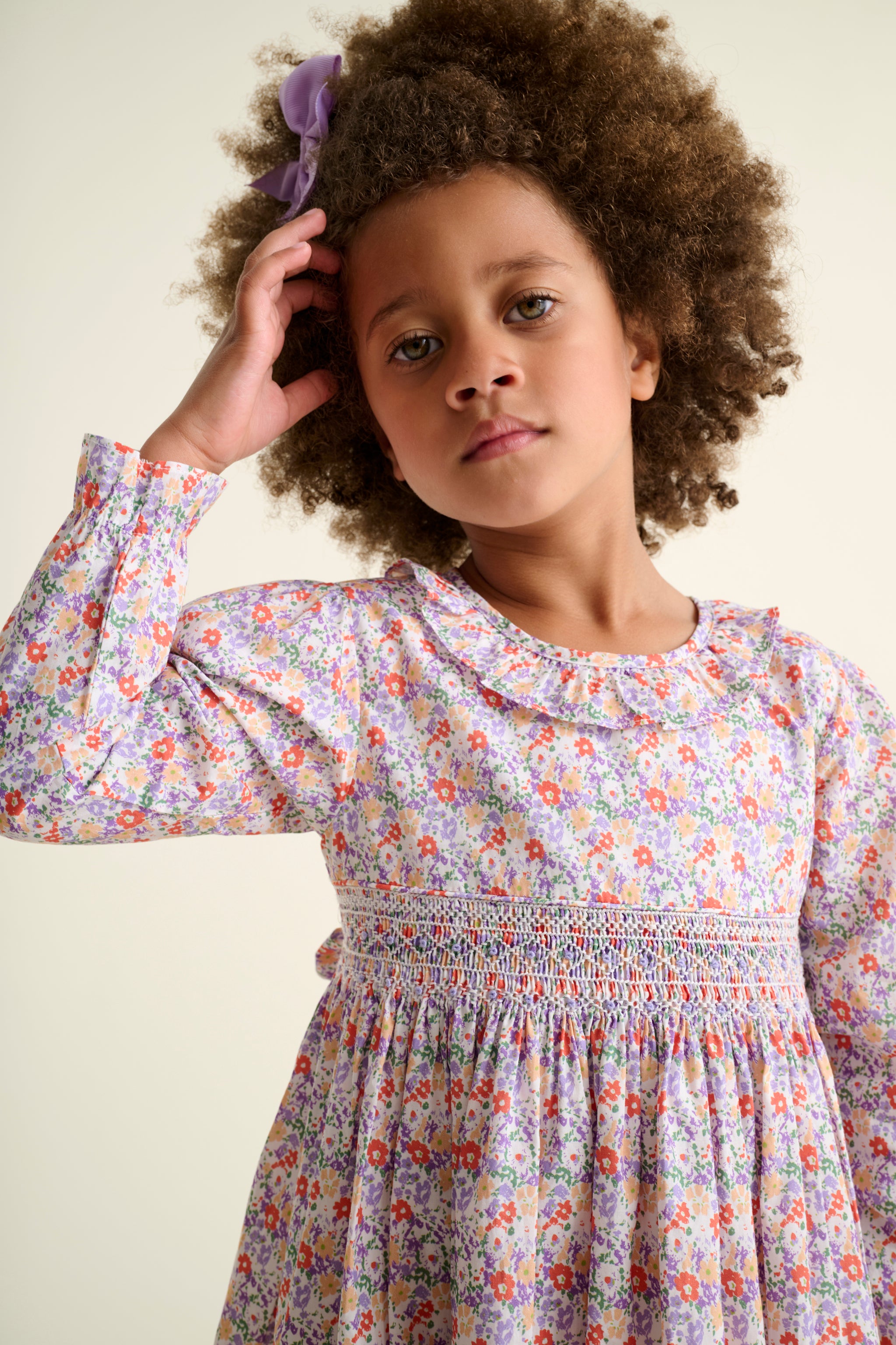 floral smock dress multi colour worn by child model

