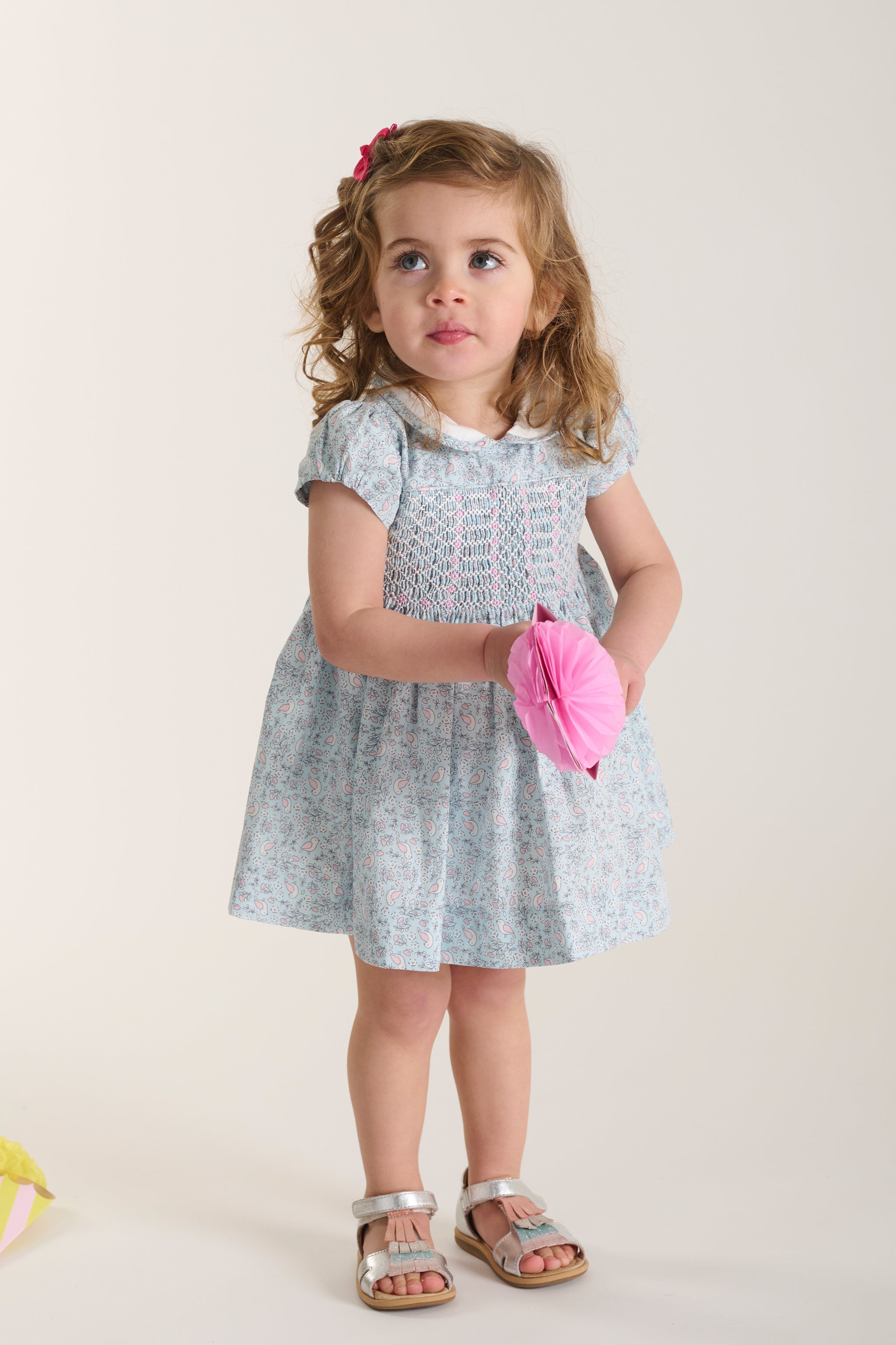 toddler in bird pattern dress aderyn
