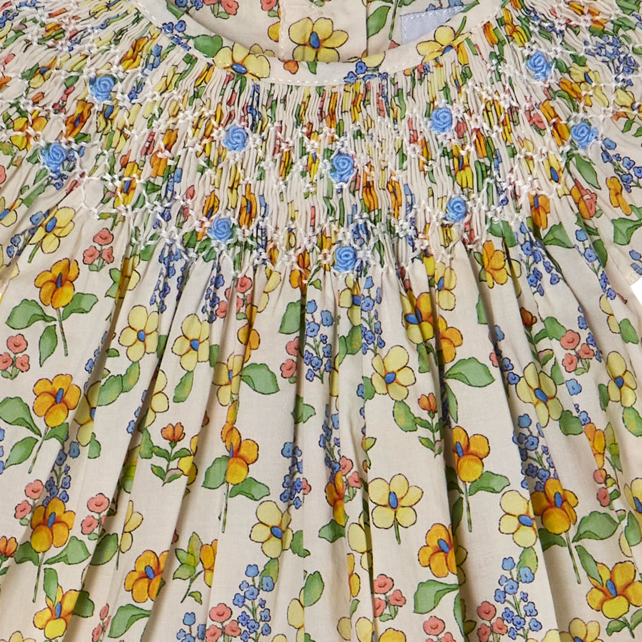 smocking detail on floral baby dress