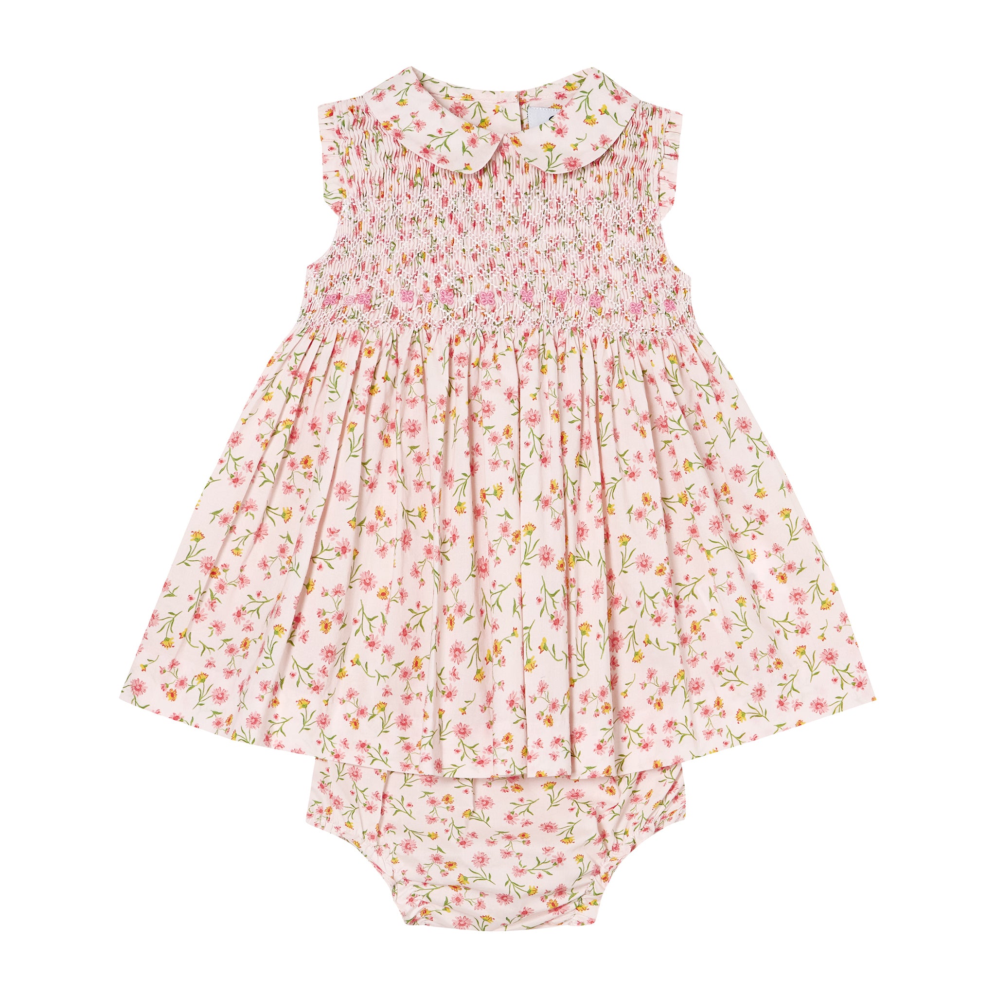 Floral baby dress and bloomers set on a white background