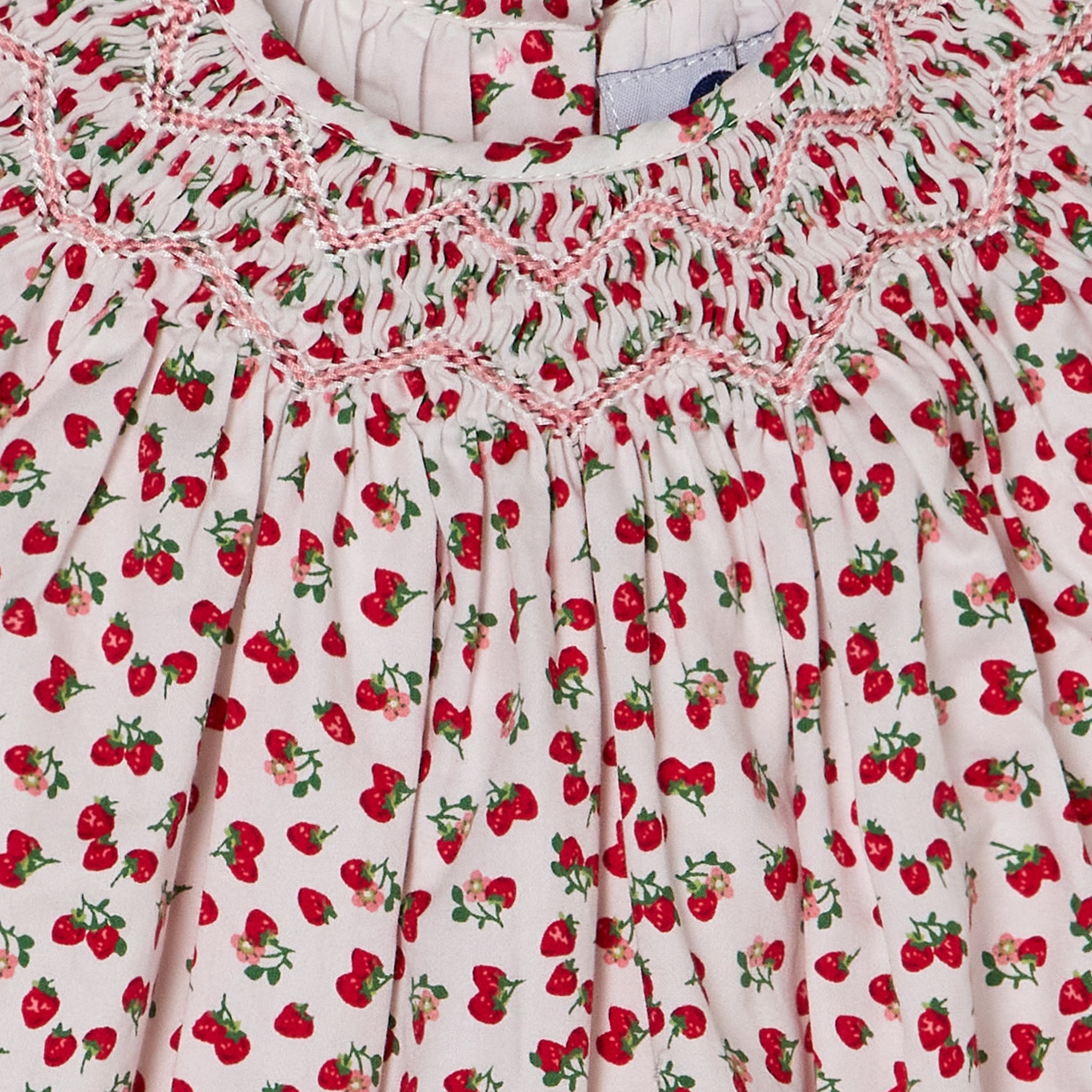 smocking closeup strawberry romper
