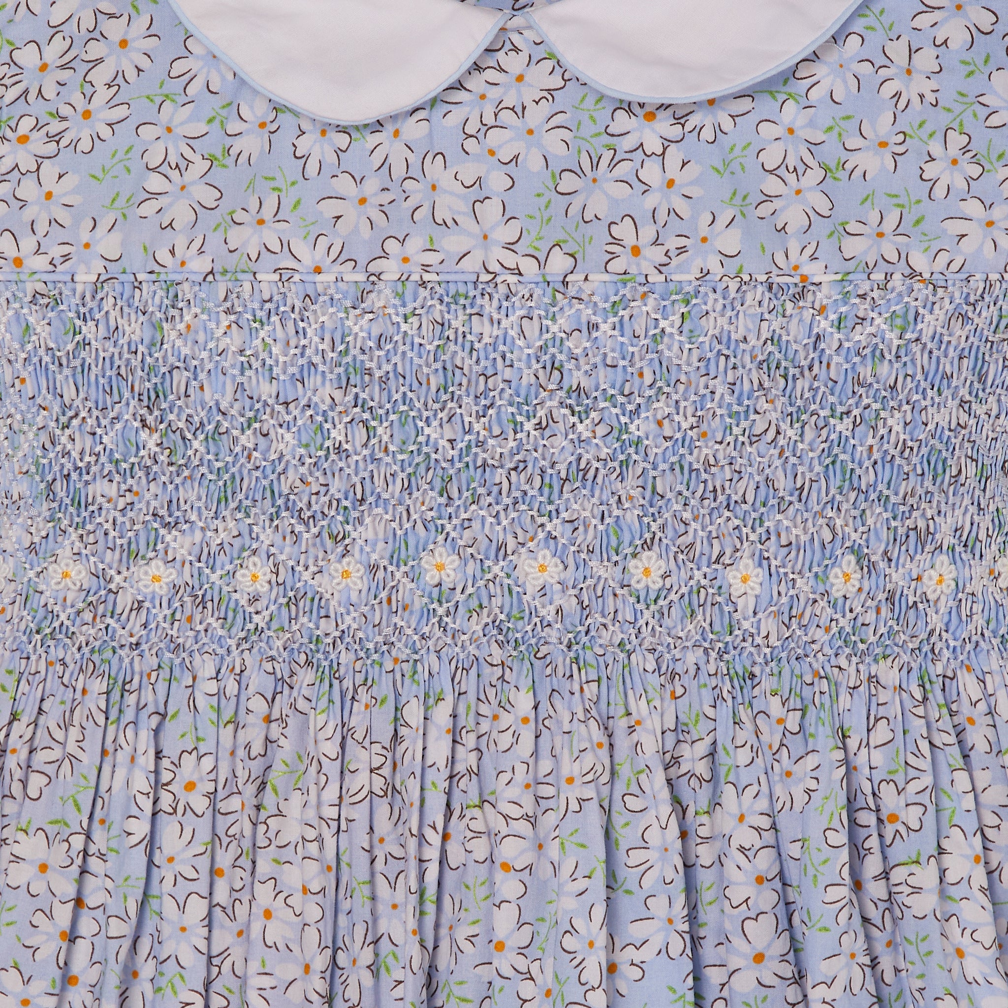 pale blue smock dress with daisy embroidery, smocking