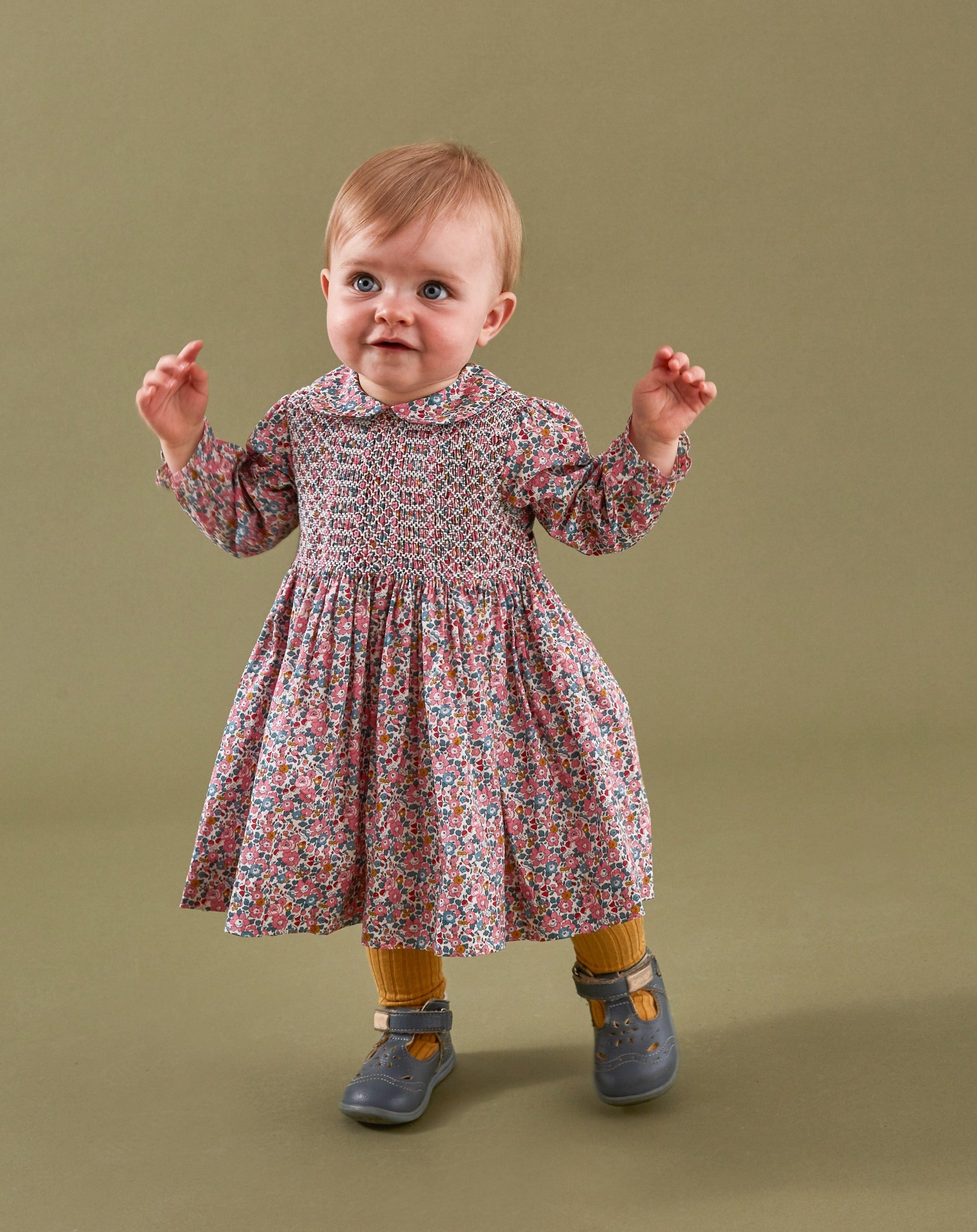 toddler girl  in Liberty print smocked dress