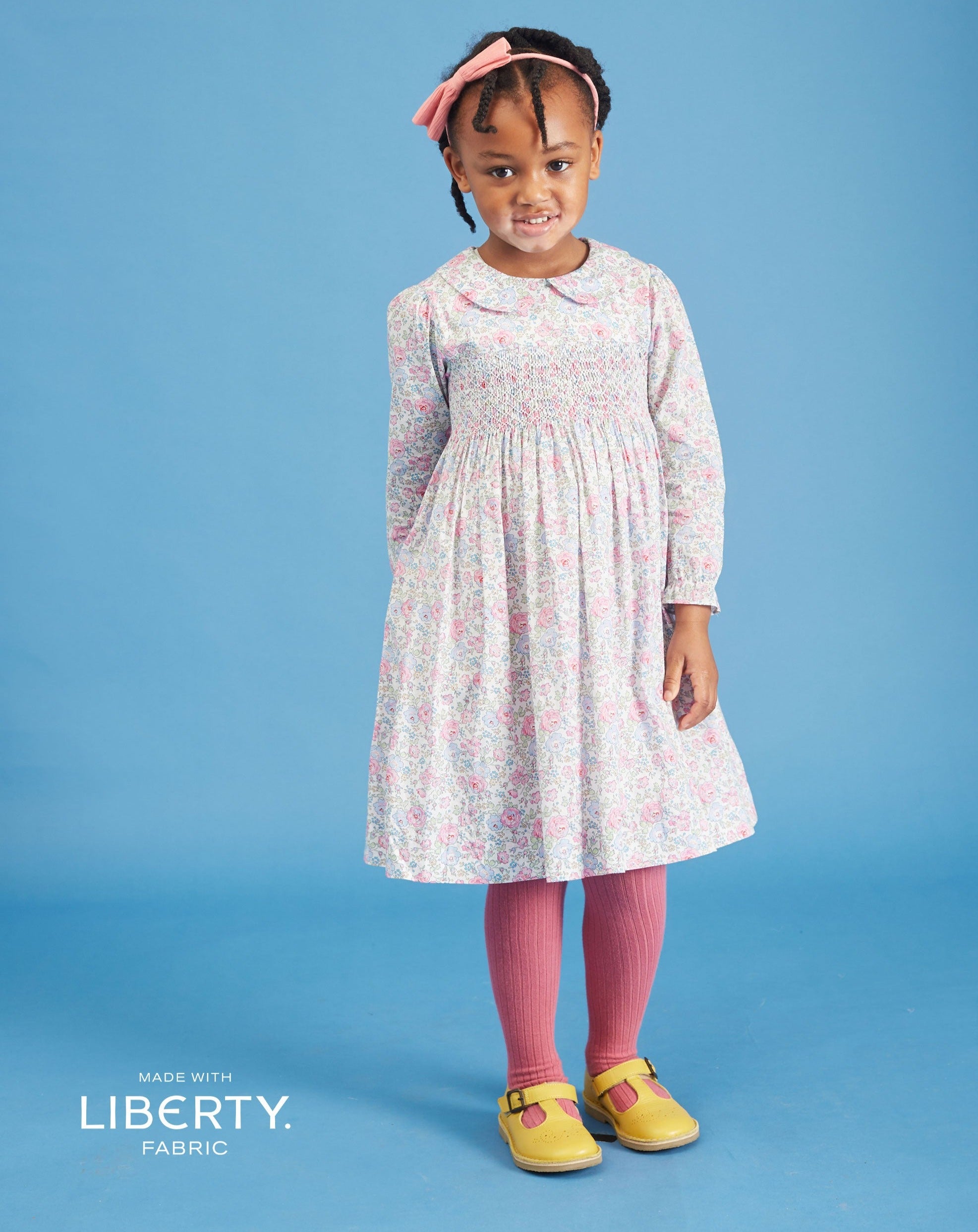 girl in smocked dress made from Liberty fabric