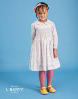 girl in smocked dress made from Liberty fabric