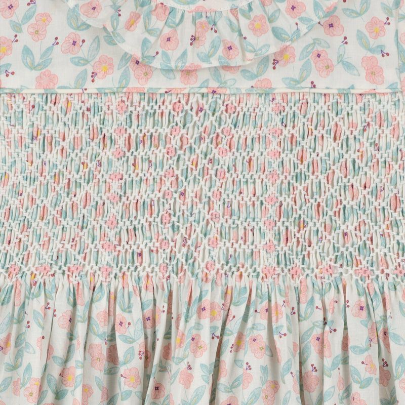 smocked floral baby dress with frill collar, smocking detail