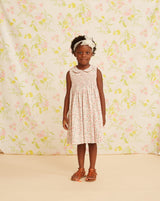 girl in smocked summer dress