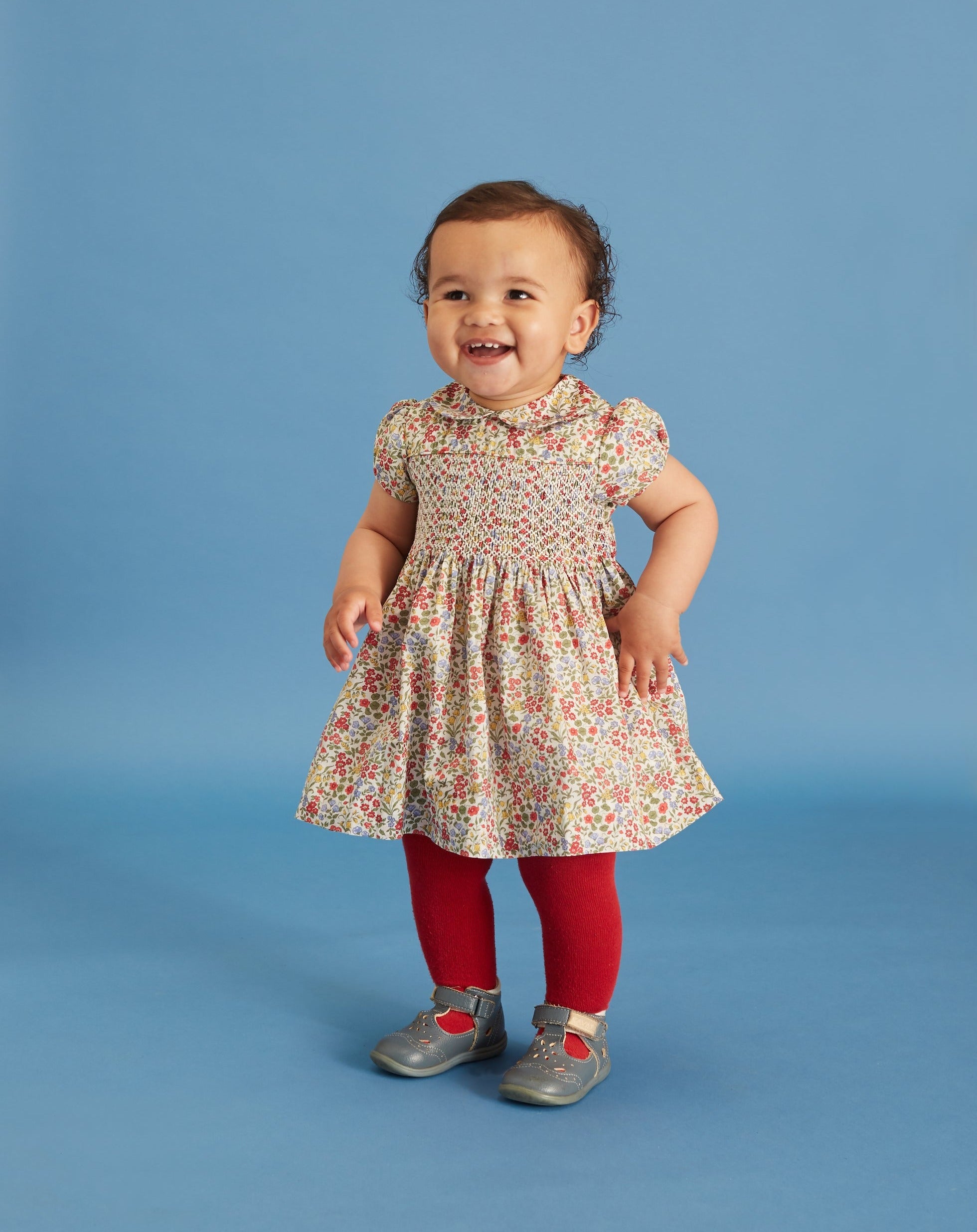 toddler in hand-smocked Liberty fabric dress