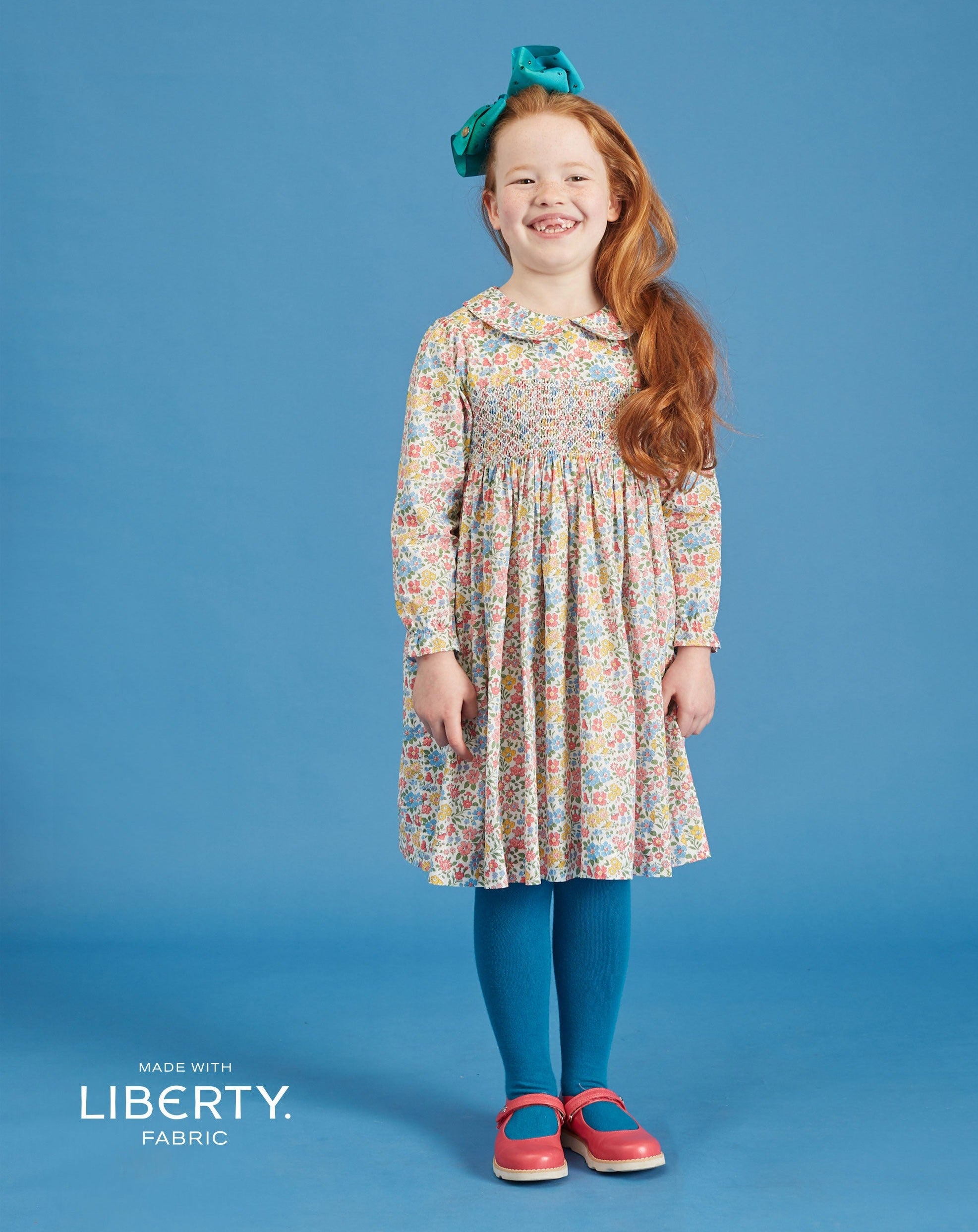 girl wearing liberty print dress