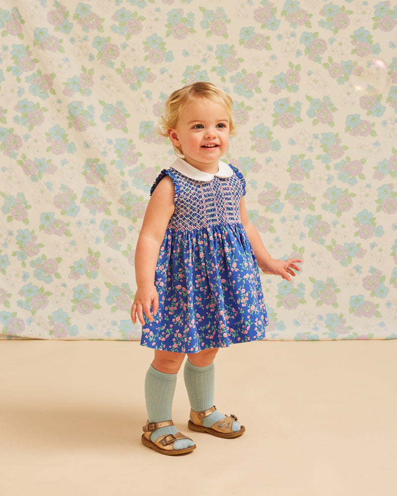 Baby in blue floral summer dress