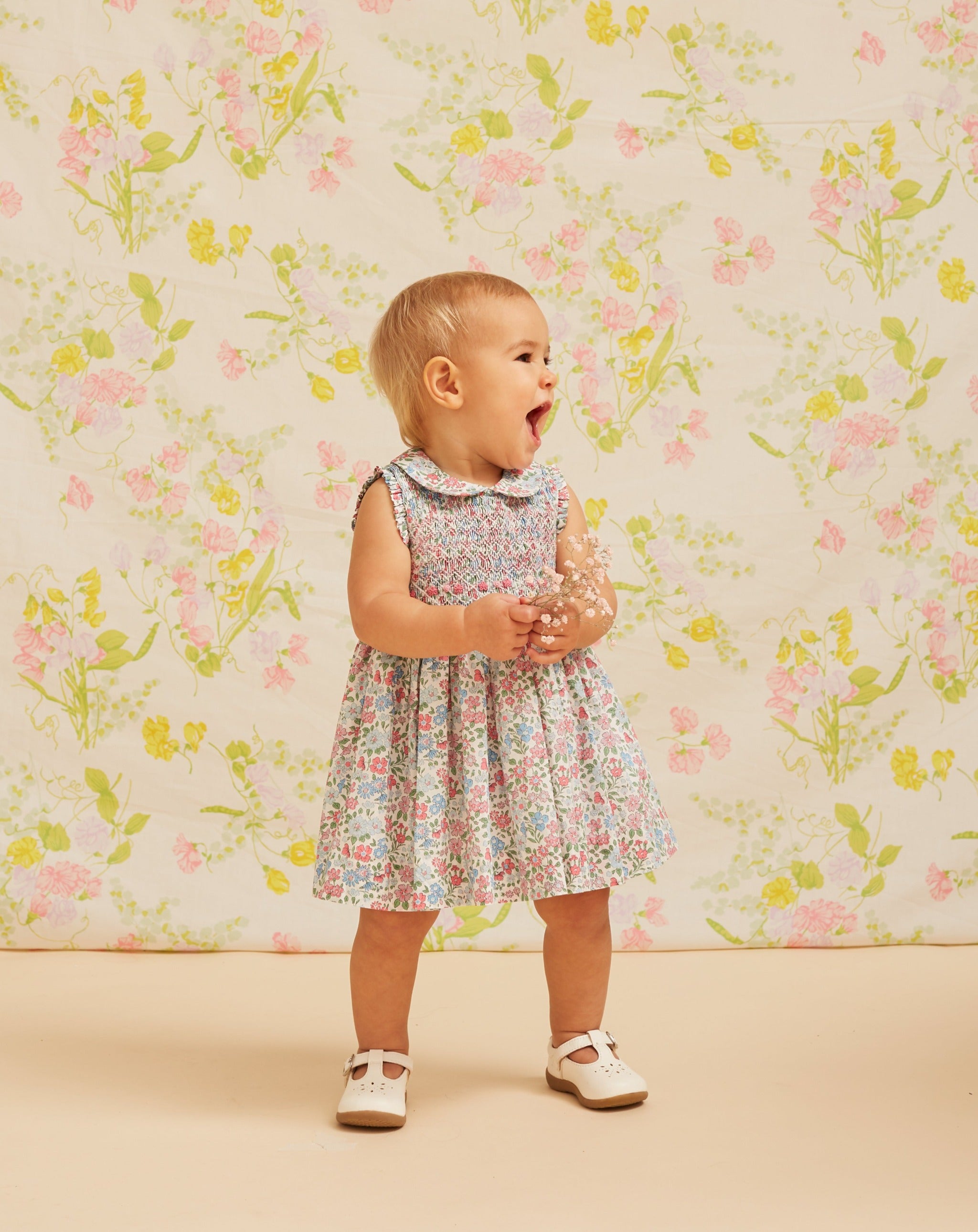 Baby in sleeveless smocked dress