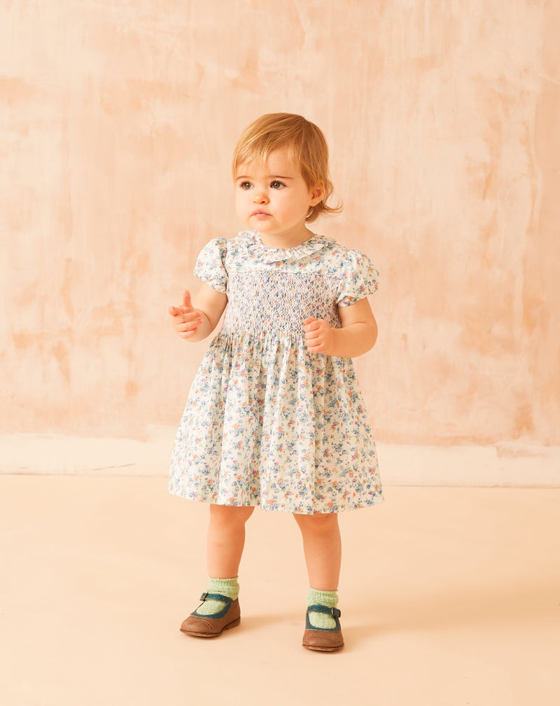 toddler girl in smocked summer dress