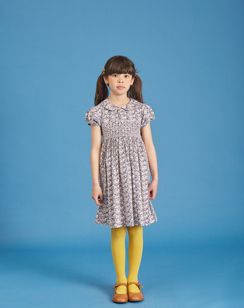 girl wearing hand-smocked dress