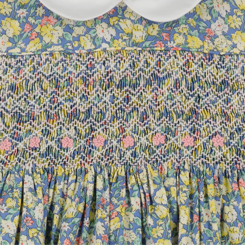  hand-smocked floral dress with white Peter Pan collar, close up