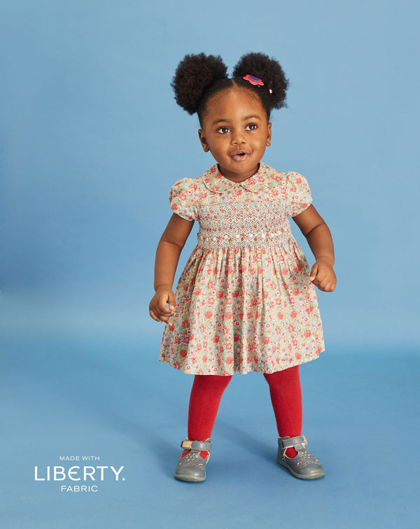 toddler in Liberty print smock dress